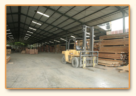 Forklift moving stock inside the warehouse.